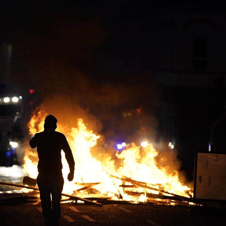 Police use water cannon in response to anti-immigrant violence in Northern Ireland town